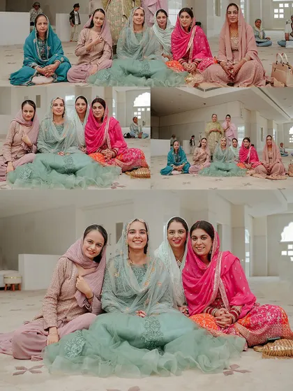 A beautiful group portrait of the bride with her family and friends inside the Gurudwara, showcasing the colorful traditional outfits.