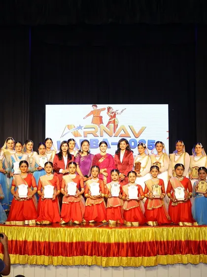 A group photo on stage at Arnav Habba 2025 with our special guest, Ragini Prajwal, and our talented students.