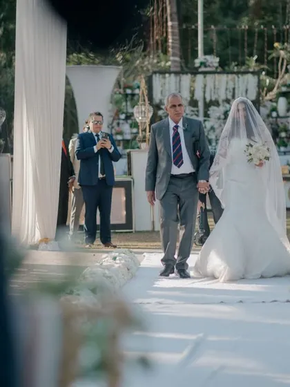 The bride's grand entrance, walking down the aisle with her father.