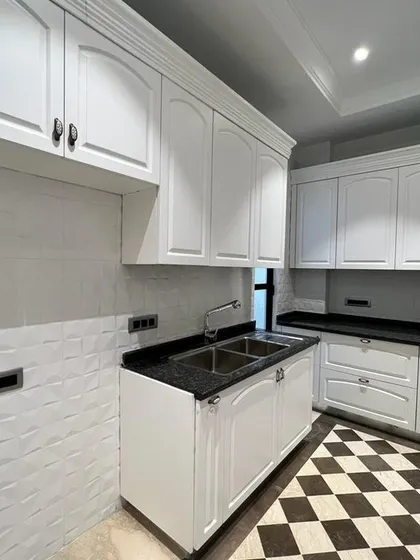 A wider view of the C-257 kitchen, showcasing the ample cabinet space and the classic design that makes it a joy to cook in.