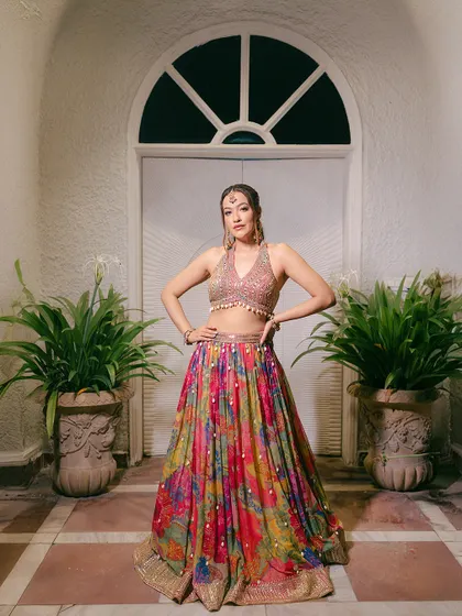 A full-length portrait of the bride in her colorful Mehendi outfit, posing confidently and showing off her festive look.