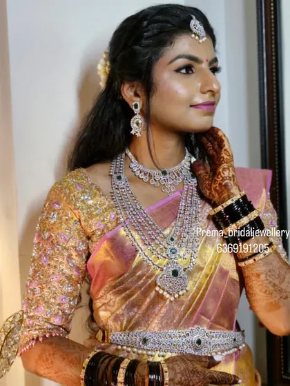 The full look, including the intricate AD stone vaddanam.
