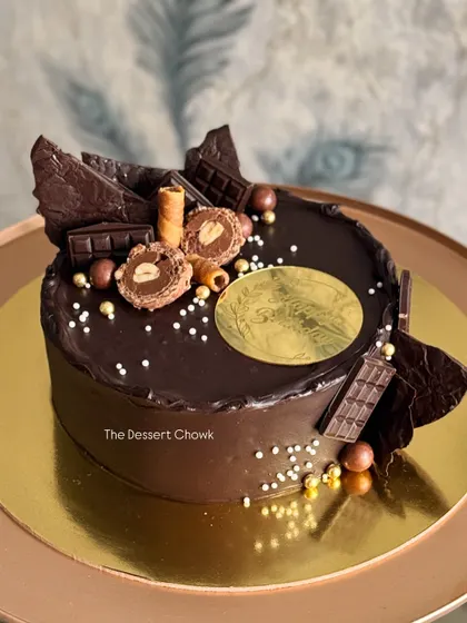 A decadent chocolate truffle cake overloaded with chocolate shards, wafers, and Ferrero Rocher. This is my go-to design for anyone who believes more chocolate is always better.