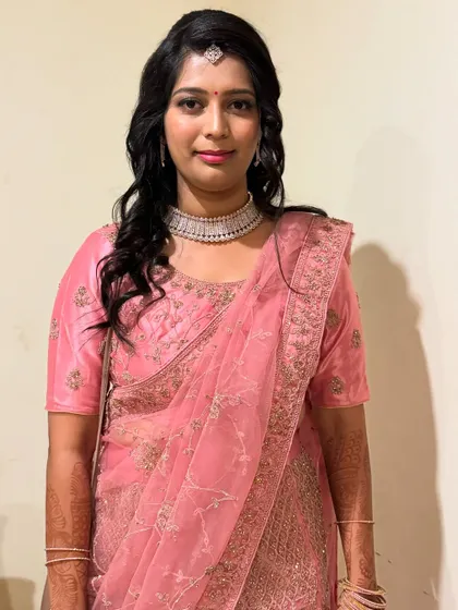 A lovely non bridal look for Ramya. The sheer pink saree is draped to create a soft and feminine silhouette, perfect for a party or reception.