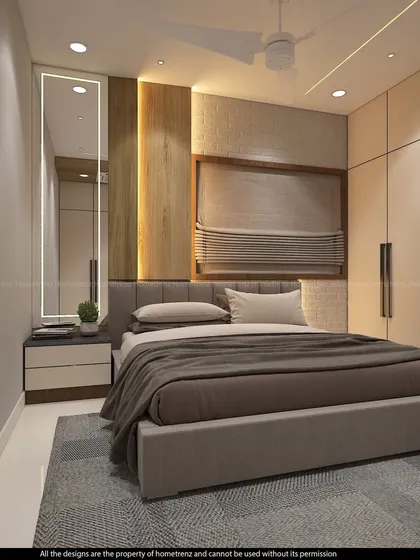 A guest bedroom with a simple, elegant design, featuring a fabric-upholstered bed, a back-lit mirror, and a large wardrobe.