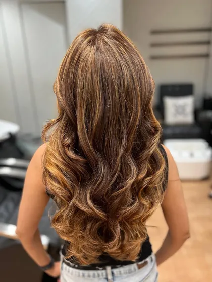 An exquisite hair transformation using our expert balayage service. This blonde balayage gives a seamlessly blended, sun-kissed look.