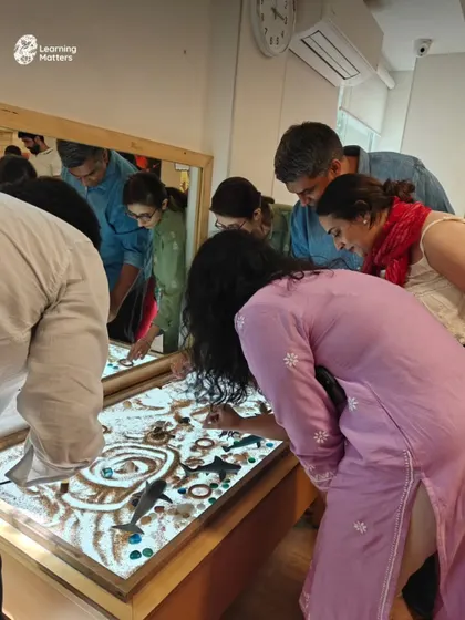 Watching parents explore the light table with the same curiosity as children is a beautiful reminder that imagination has no age limit. When adults step into a child's world, they rediscover the joy and power of play.