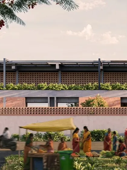 The school's facade as seen from the street, with its brick jali work and planters, responds to the local context. The design creates a dignified yet approachable institutional presence that is integrated with the life of the town.
