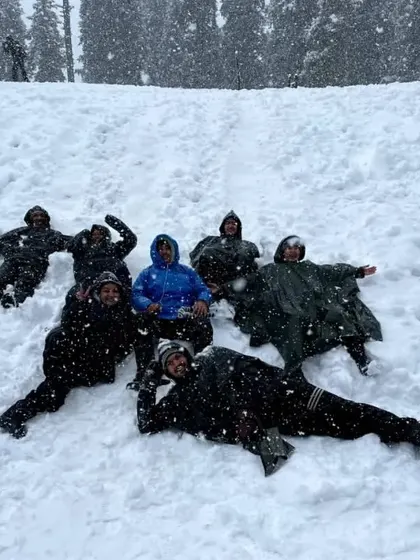 Making snow angels at the Juda Ka Talab campsite. Our winter treks are not just about reaching the summit; they are about having fun and playing in the pristine Himalayan snow.