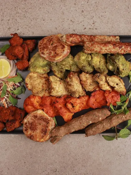 Our non veg platter is the perfect choice when you cannot decide what to order. It features a generous assortment of our signature kebabs, including Mutton Seekh, Chicken Boti, and Galouti, served with a side of salad.