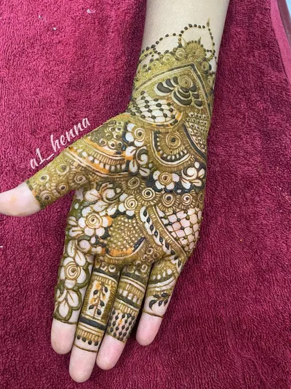 A single hand showcasing a detailed and intricate party design.