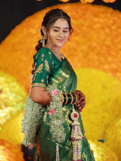 This bride is blooming in our fresh flower jewellery for her Haldi. We created these beautiful kalire and armlets using baby's breath and other delicate white flowers.