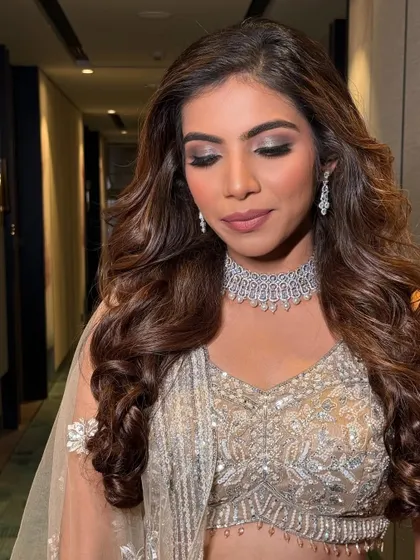 A close-up of the beautiful eye makeup. The soft, shimmering tones create a look that is both romantic and glamorous.