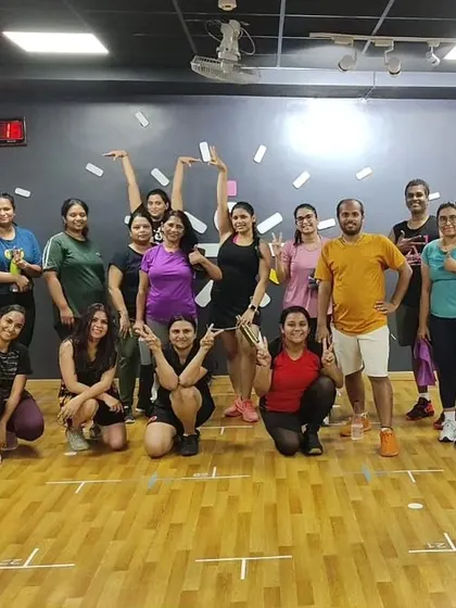 The heart and soul of my classes. Each photo captures a unique moment with my incredible community after a sweaty, joyful session. This is our shared victory lap.