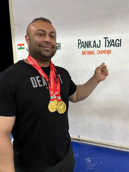 Proudly displaying my gold medals next to my name, "Pankaj Tyagi - National Champion." This is the identity earned through relentless hard work.