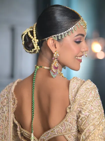 When less is truly more. This side profile highlights the elegant hair and the soft ivory glam makeup that enhances natural beauty, creating an effortlessly radiant bridal look.