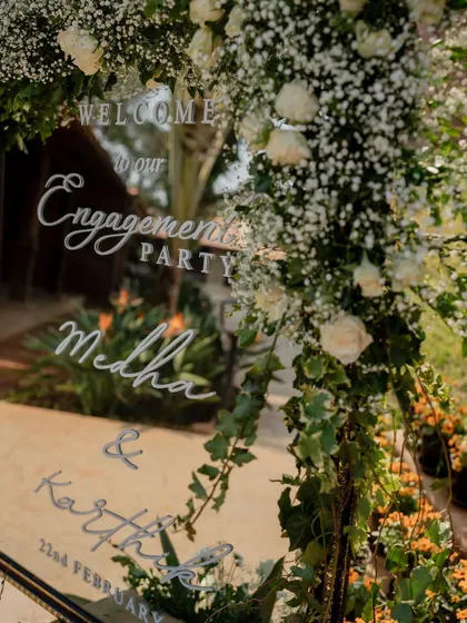 A personalized welcome mirror for Medha and Karthik's engagement party.