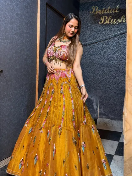 A full-length shot of the yellow haldi lehenga, showing its beautiful color and design.