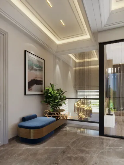 A cozy and stylish seating nook in a hallway, featuring a blue velvet bench and modern art, turning a passageway into a functional resting spot.