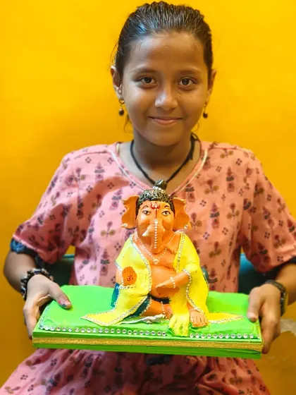 This young artist created her own Ganpati from scratch and painted it. Our classes empower students to handle every step of the creative process, from sculpting to final touches.