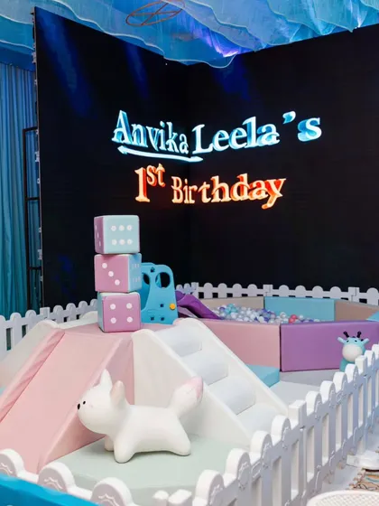 A dedicated soft play area for the youngest guests. The pastel-colored ball pit and climbing blocks provide a safe and fun space for toddlers to play, all within the party's theme.
