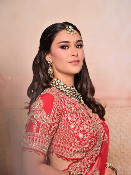 A beautiful three-quarter portrait that highlights the sculpted cheekbones and glowing skin of the bride.