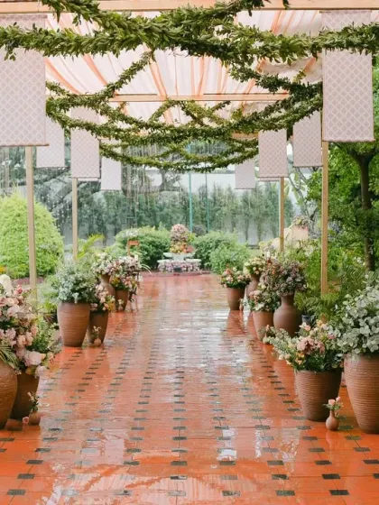 Even a rainy day can be beautiful. We used subtle pastel drapes, handmade pots, and peach florals to create an intimate and romantic atmosphere that glowed, even with the rain.