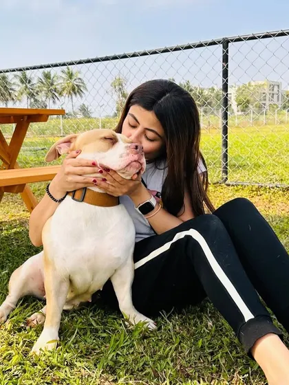 A moment of pure love and affection between a pet parent and her dog.