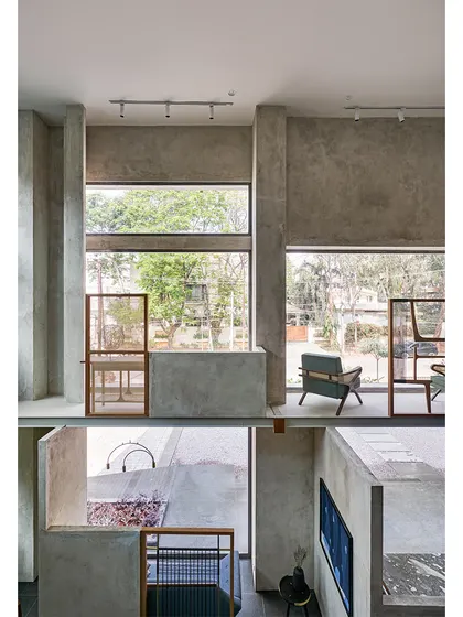 The interior architecture of the Magari store features layered spaces and split levels, creating distinct zones to display furniture collections while maintaining a sense of openness.