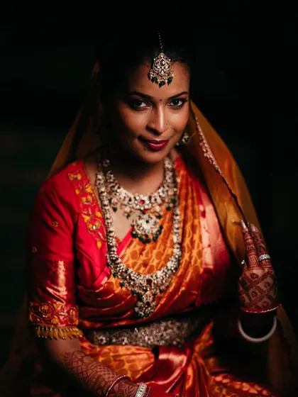 A key part of our signature style is using dramatic lighting to create timeless bridal portraits. Here, we focused on highlighting the bride's graceful expression and the stunning detail of her traditional wedding jewelry and attire.