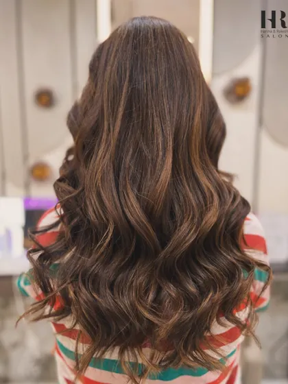 A happy client showing off her fresh balayage and bouncy blowout. The color adds so much brightness and dimension.