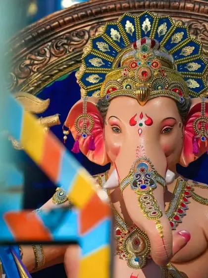 A beautifully framed close-up of the Sanpada Cha Raja, using foreground elements to add depth to the portrait.