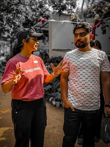 One of our organizers in conversation, ensuring everything runs smoothly at the Garage Sale.