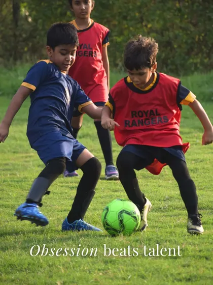 A powerful action shot that reinforces my core belief: obsession beats talent. The player in the red bib shows the hunger and fight that I look for.