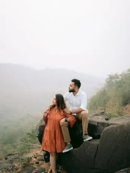 A thoughtful, scenic shot of the couple looking out over a valley, perfect for a cinematic pre-wedding album.