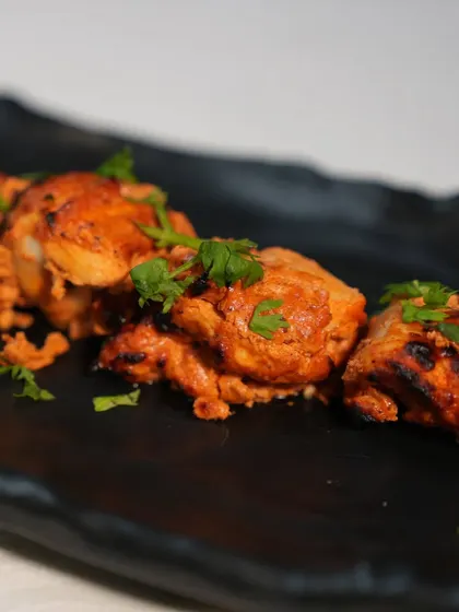 Sink your teeth into the succulent flavours of Murgh Rasila Tikka. Juicy, marinated chicken with a burst of spices, grilled to perfection.