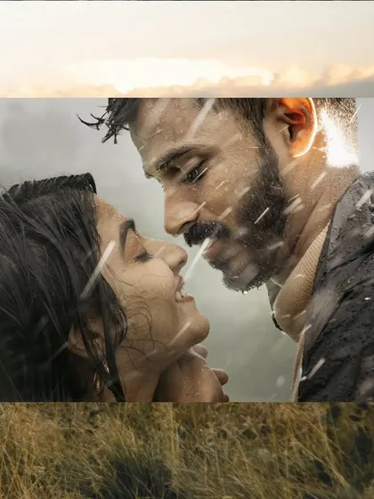 Embracing the romance of a rainy day. This atmospheric pre-wedding photo captures a close, intimate moment between a couple, with the falling rain adding a touch of cinematic magic.