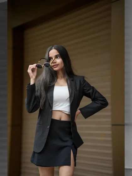 Capturing the modern boss-babe energy on the streets of Mumbai. This is for the influencer or brand that owns their power. The focus is on creating a chic, confident look with clean lines and an urban backdrop.