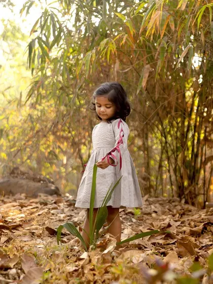 A quiet moment of exploration during her third birthday shoot. I love watching children interact with nature, as their curiosity leads to beautiful and serene photographs.