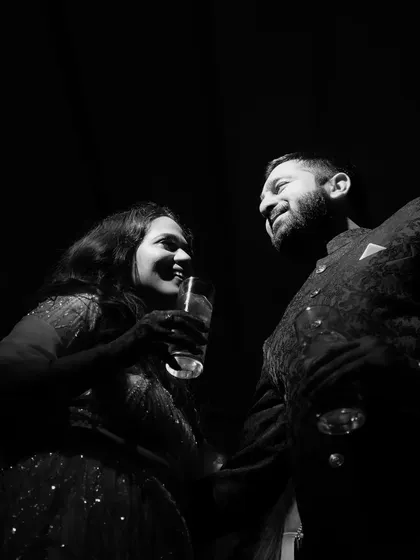 A quiet, intimate moment on the dance floor. This black and white shot feels personal and timeless, focusing on the couple's connection.