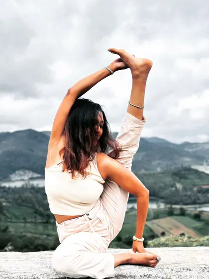 This is a moment of deep focus and flexibility in an advanced asana. My practice is a continuous journey of exploring the body's limits with patience and compassion, a principle I bring into every class and workshop I guide.