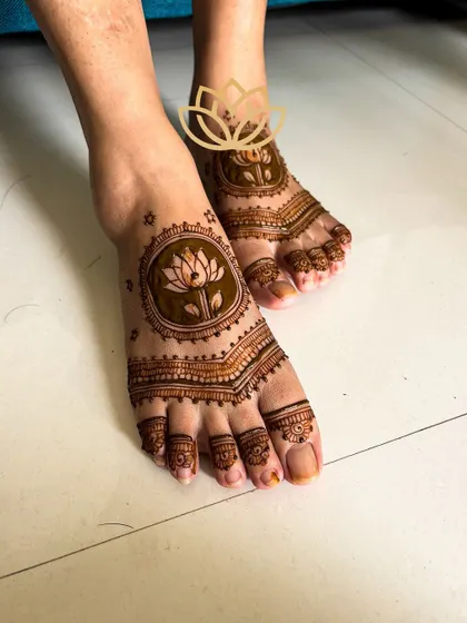 A simple yet elegant lotus mandala design for the feet, a perfect complement to a more intricate hand design.