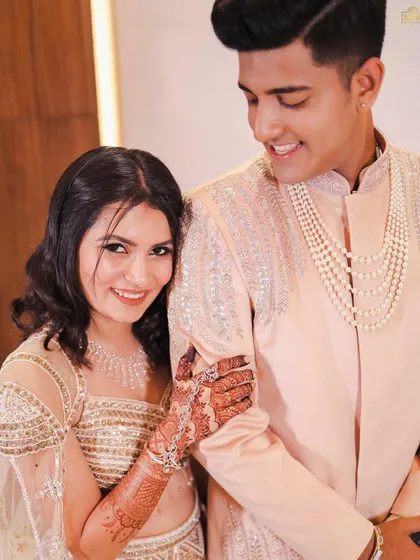 A sweet moment between Bhoomi and her fiancé. Her makeup is soft and romantic, perfect for these couple portraits.