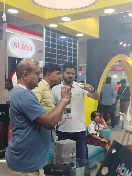 Here I am at an exhibition, personally demonstrating the features of my home automation products to interested visitors. I believe in hands-on explanations to show the true value of my services.