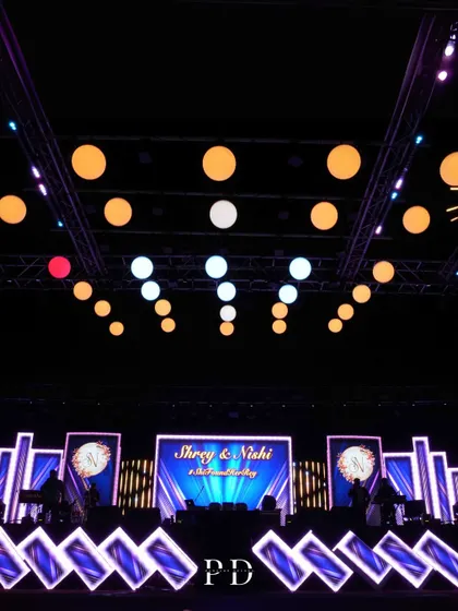 A massive LED stage setup for a grand Sangeet, with custom graphics and dynamic lighting creating a concert-like experience.
