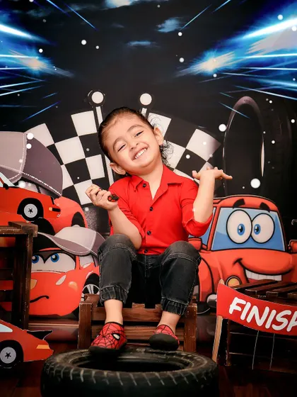 Full of personality in this "Cars" movie inspired theme. The checkered flag and race track details make for a high-energy and fun photoshoot.