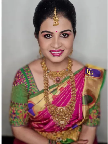 A beautiful portrait of Preethi, her smile showing her happiness with the glamorous yet traditional makeup look.