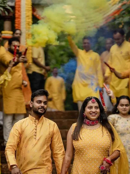 The grand entrance with colorful smoke bombs makes for an epic start to the Haldi festivities. We love capturing the energy and excitement of the wedding party.