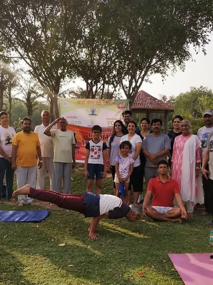Another group photo from our International Yoga Day celebration, with me holding a strong Mayurasana. It's a joy to see so many families and individuals come together for health and wellness.