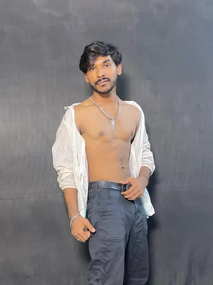 An unbuttoned shirt look, showcasing a more edgy and bold style. I am not afraid to experiment with different fashion choices for a role.